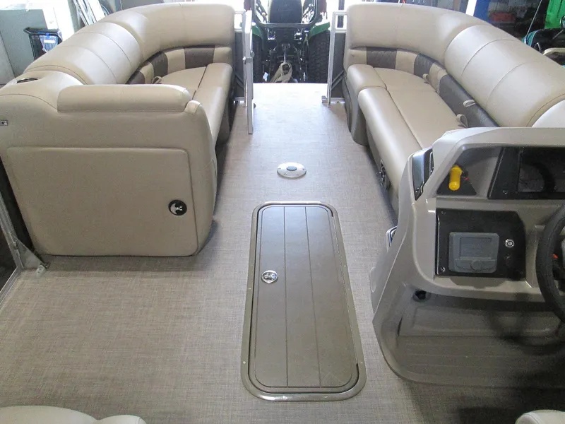 Slide: The Image of 2024 Sun Tracker Party Barge 22 XP3 interior with spacious seating and modern controls. - 12