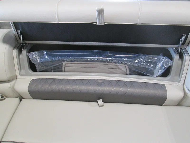 Slide: The Image of 2024 Sun Tracker Party Barge 22 XP3 storage compartment with cushioned seating. - 7