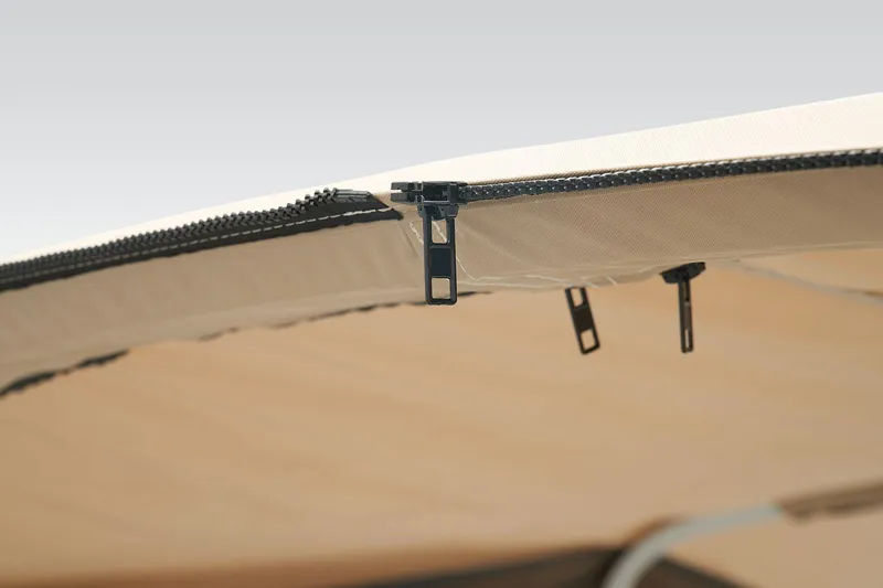 Slide: The Image of Close-up of Sun Tracker SportFish 22 XP3 2024 boat canopy zipper. - 48