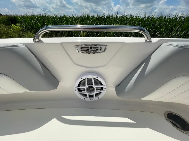 Slide: The Image of 2024 Chaparral 21 SSi OB boat interior with speaker and logo. - 11