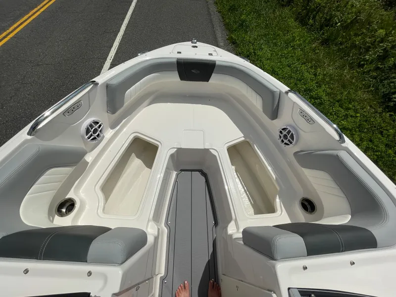 Slide: The Image of 2024 Chaparral 21 SSi OB boat interior, bow seating area with storage compartments. - 13