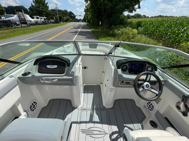 Slide: The Image of 2024 Chaparral 21 SSi OB boat interior with steering wheel and dashboard. - 15