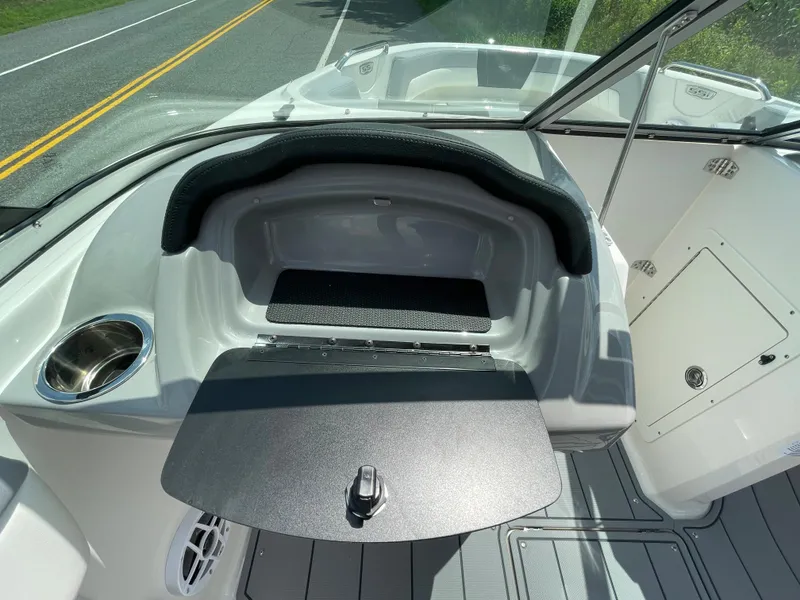 Slide: The Image of 2024 Chaparral 21 SSi OB boat interior with open storage compartment. - 20