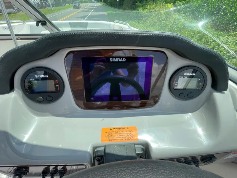 Slide: The Image of Dashboard of 2024 Chaparral 21 SSi OB boat with Simrad display. - 24
