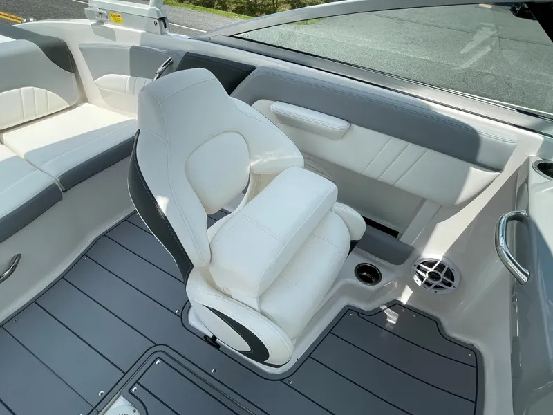 Slide: The Image of 2024 Chaparral 21 SSi OB boat interior with white and gray seating. - 32
