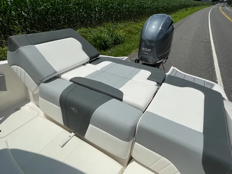 Slide: The Image of 2024 Chaparral 21 SSi OB boat with Yamaha 150 outboard motor, rear seating view. - 39
