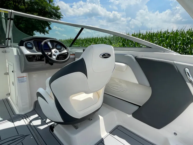 Slide: The Image of 2024 Chaparral 21 SSi OB boat interior with captain's chair and dashboard. - 40