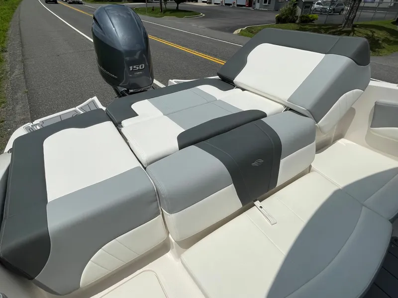Slide: The Image of 2024 Chaparral 21 SSi OB boat with comfortable seating and outboard motor. - 44