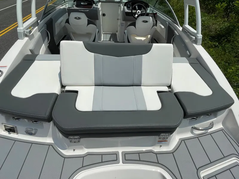 Slide: The Image of 2024 Chaparral 21 SSi OB boat interior with gray and white seating. - 48