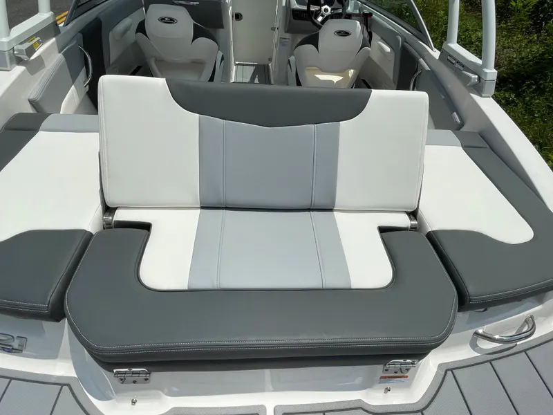 Slide: The Image of 2024 Chaparral 21 SSi OB boat interior seating with gray and white upholstery. - 49