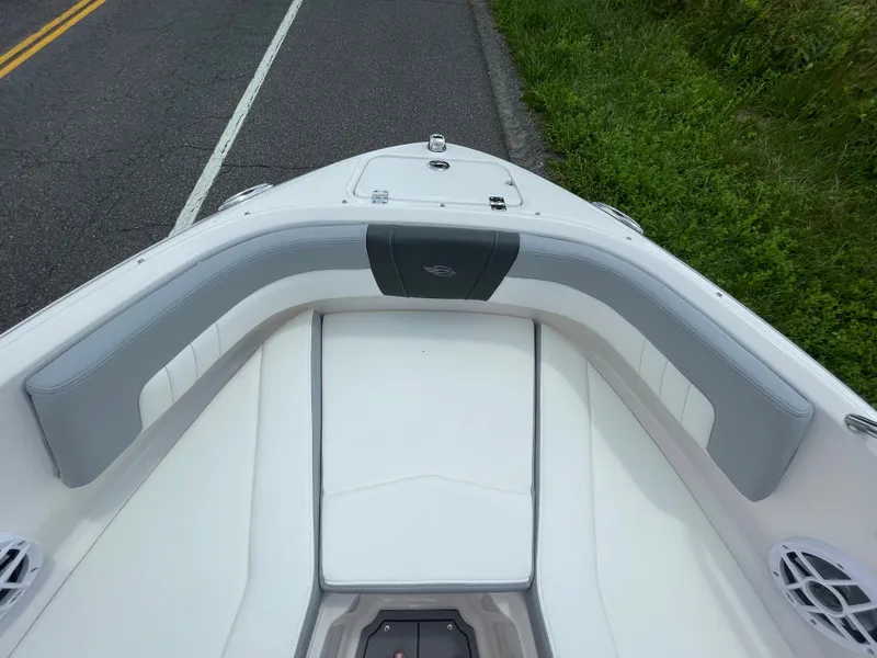 Slide: The Image of 2024 Chaparral 21 SSi OB boat bow seating area with gray and white upholstery. - 7