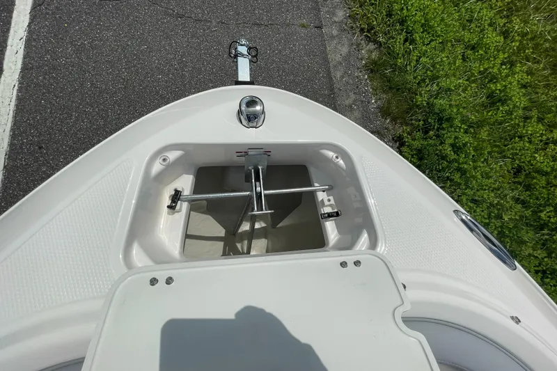 Slide: The Image of 2024 Chaparral 21 SSi OB boat bow with anchor storage compartment. - 8