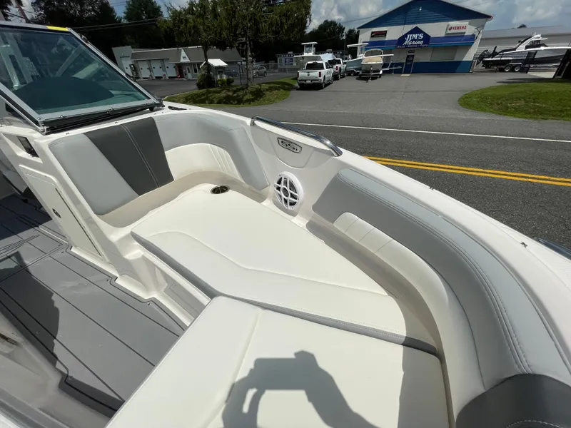Slide: The Image of 2024 Chaparral 21 SSi OB boat interior with white and gray seating. - 9