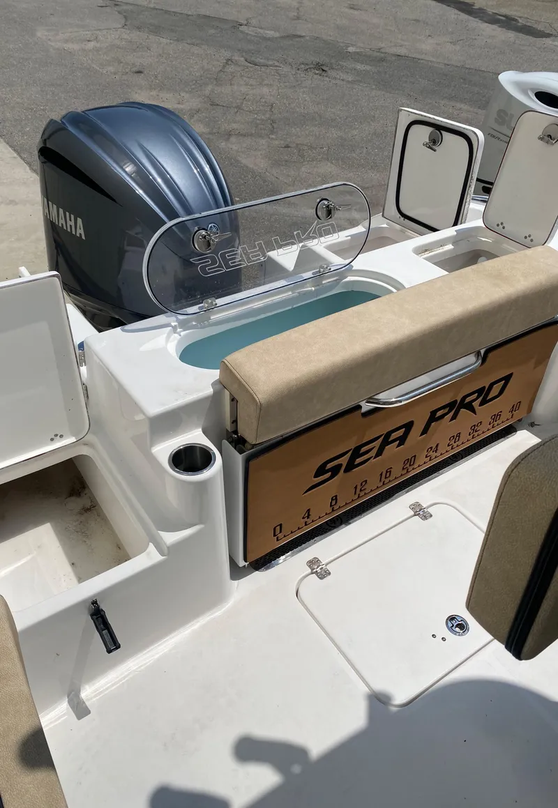 Slide: The Image of 2023 Sea Pro 239 boat with Yamaha engine and fishing amenities. - 11