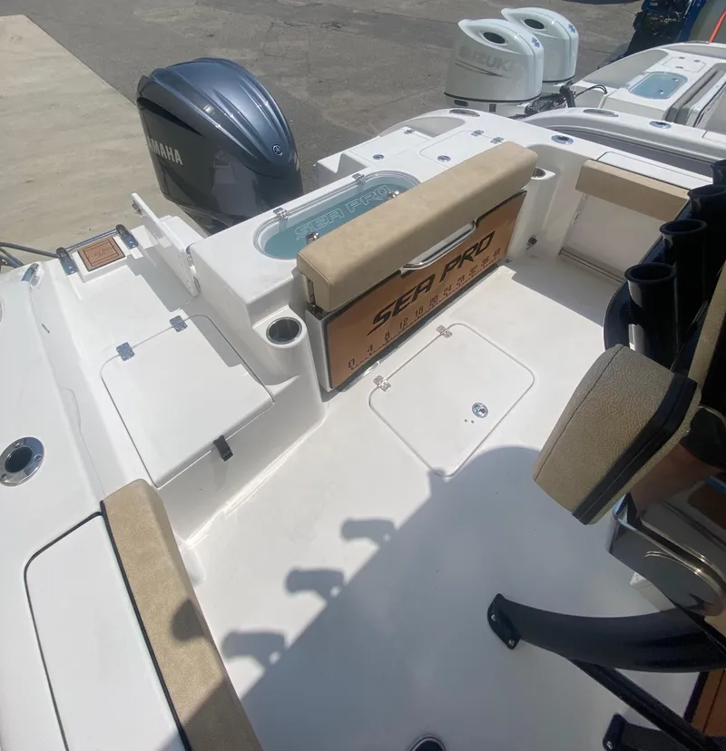 Slide: The Image of 2023 Sea Pro 239 boat interior with Yamaha outboard motor. - 12