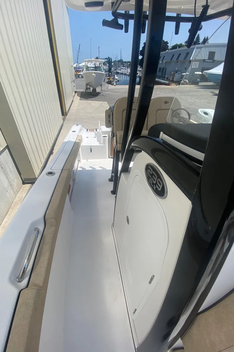 Slide: The Image of 2023 Sea Pro 239 boat interior view at a marina. - 15