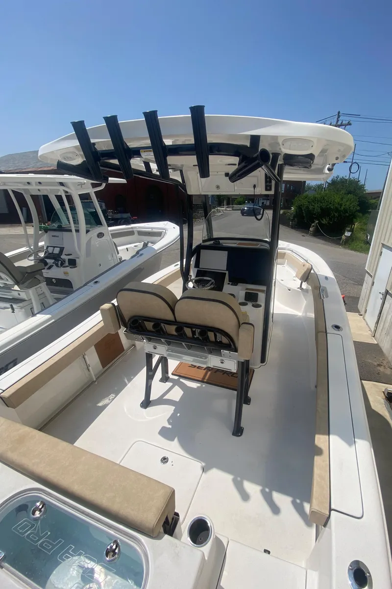 Slide: The Image of 2023 Sea Pro 239 center console boat with seating and T-top. - 16