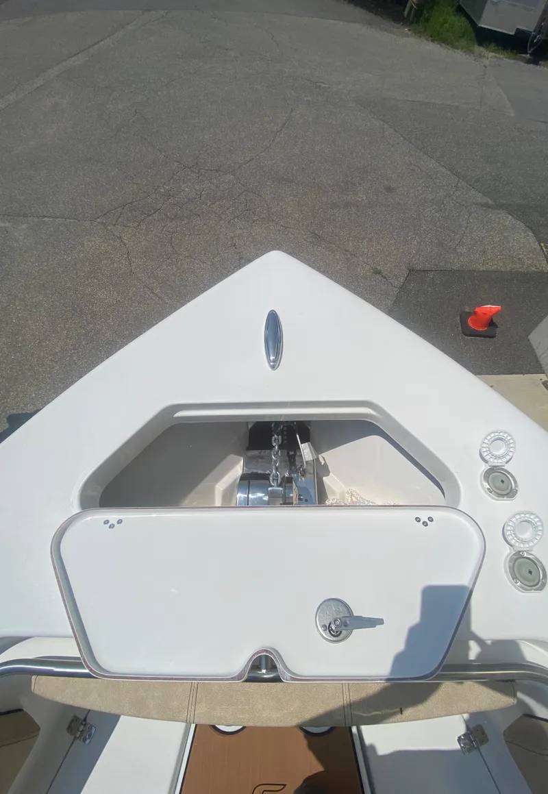 Slide: The Image of 2023 Sea Pro 239 boat bow with anchor storage compartment. - 17