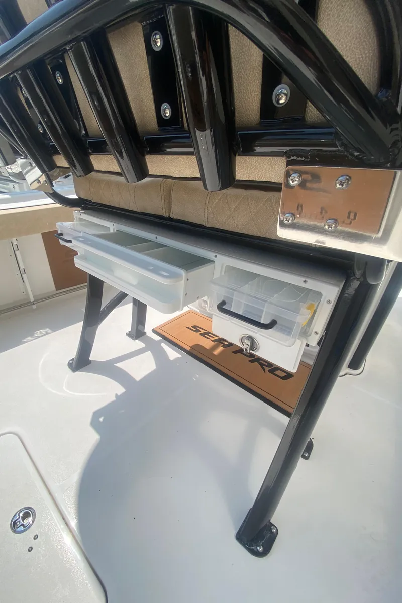 Slide: The Image of 2023 Sea Pro 239 boat with under-seat storage drawers. - 18