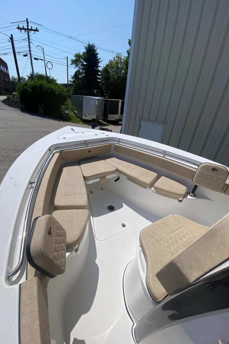 Slide: The Image of 2023 Sea Pro 239 boat with beige seating and white deck. - 8