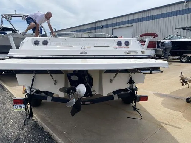Slide: The Image of 2012 Bayliner 195 Bowrider boat on trailer, rear view at marina. - 6
