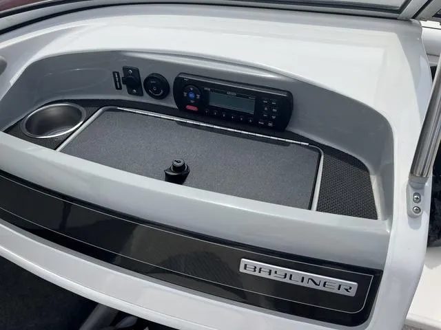 Slide: The Image of 2012 Bayliner 195 Bowrider dashboard with stereo system and cup holder. - 9