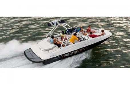 Slide: The Image of 2016 Bayliner 215 Deck Boat cruising on water with passengers. - 11