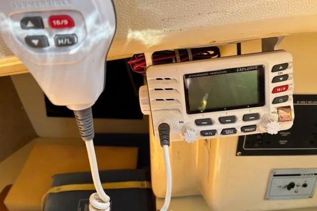 Slide: The Image of VHF marine radio equipment inside a 1984 Pearson 34 sailboat cockpit. - 12