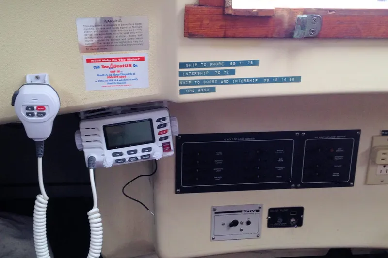 Slide: The Image of 1984 Pearson 34 sailboat interior with radio equipment and control panels. - 13
