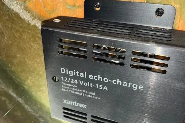 Slide: The Image of Xantrex digital echo-charge device, 12/24 Volt-15A, installed on a 1984 Pearson 34. - 15