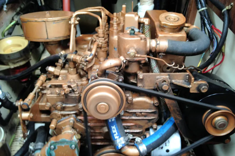 Slide: The Image of Engine of a 1984 Pearson 34 sailboat, showcasing intricate mechanical components. - 20
