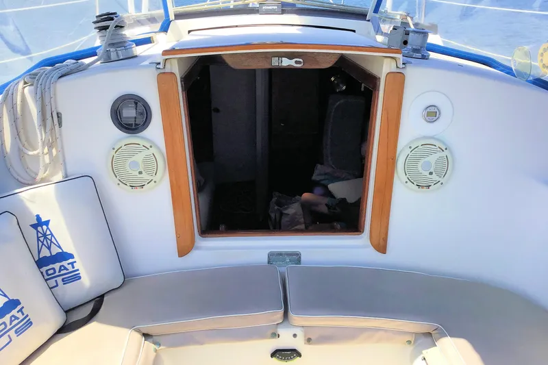 Slide: The Image of Cockpit view of a 1984 Pearson 34 sailboat with open cabin entrance. - 4