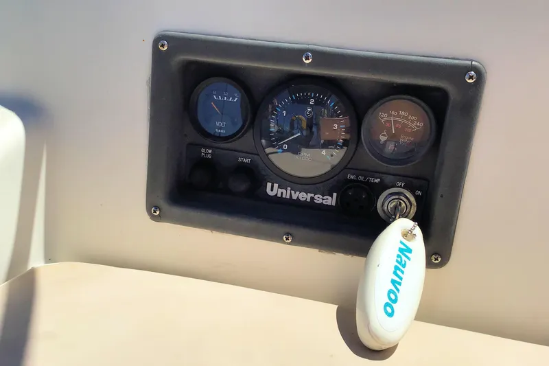 Slide: The Image of Control panel of a 1984 Pearson 34 sailboat with key and gauges. - 5