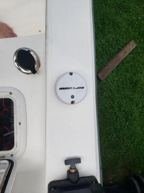 Slide: The Image of Boat deck with Minn Kota component, Caracal 180, 2008 model, on grass background. - 11