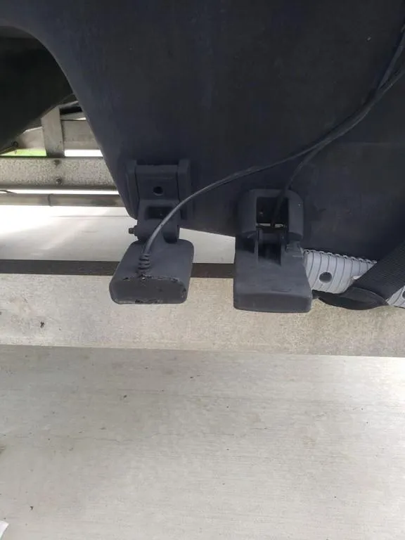 Slide: The Image of Caracal 180 boat components, 2008 model, featuring two black brackets with attached cables. - 7