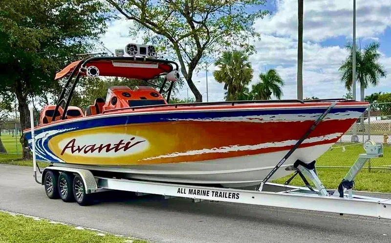 Slide: The Image of 2008 Avanti 36 boat on All Marine Trailers, vibrant red and yellow design. - 3