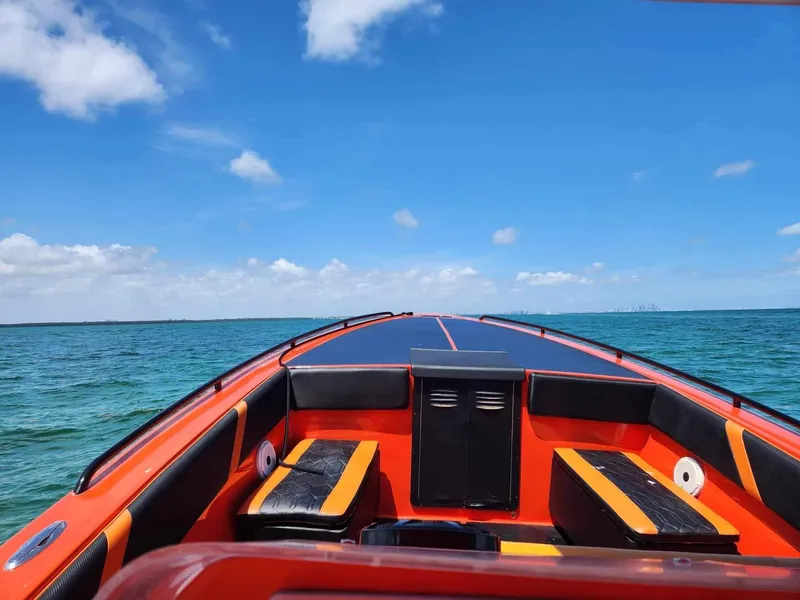 Slide: The Image of 2008 Avanti 36 boat on open water under clear blue sky. - 6