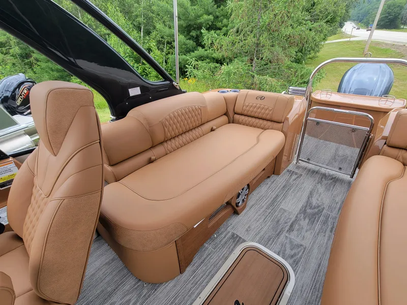 Slide: The Image of 2024 Avalon Excalibur WQL 27 Tri-Toon boat interior with luxurious tan seating. - 15