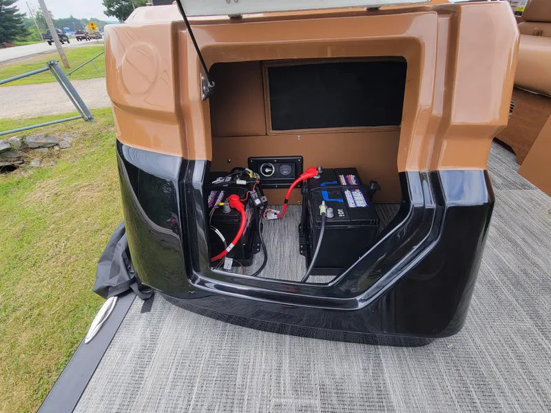 Slide: The Image of 2024 Avalon Excalibur WQL 27 Tri-Toon battery compartment with wiring. - 17