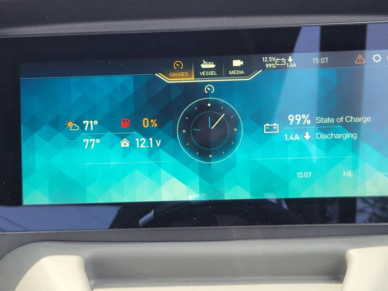 Slide: The Image of Digital dashboard of 2024 Avalon Excalibur WQL 27 Tri-Toon showing gauges and battery status. - 20