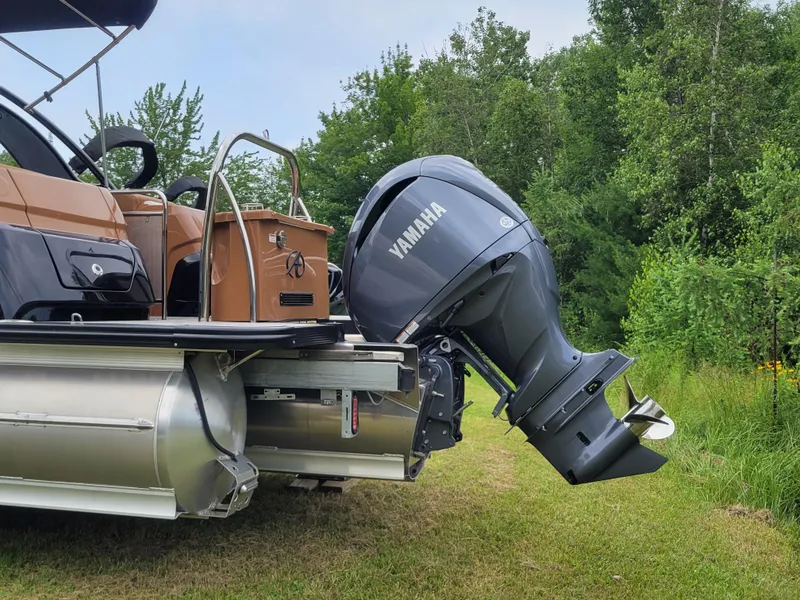 Slide: The Image of 2024 Avalon Excalibur WQL 27 Tri-Toon with Yamaha outboard motor. - 24