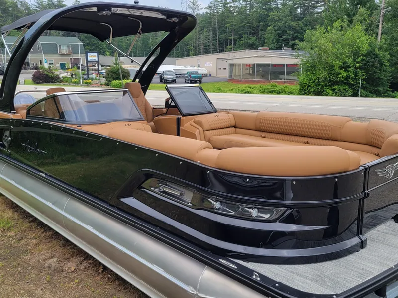Slide: The Image of 2024 Avalon Excalibur WQL 27 Tri-Toon boat with luxurious tan seating. - 6