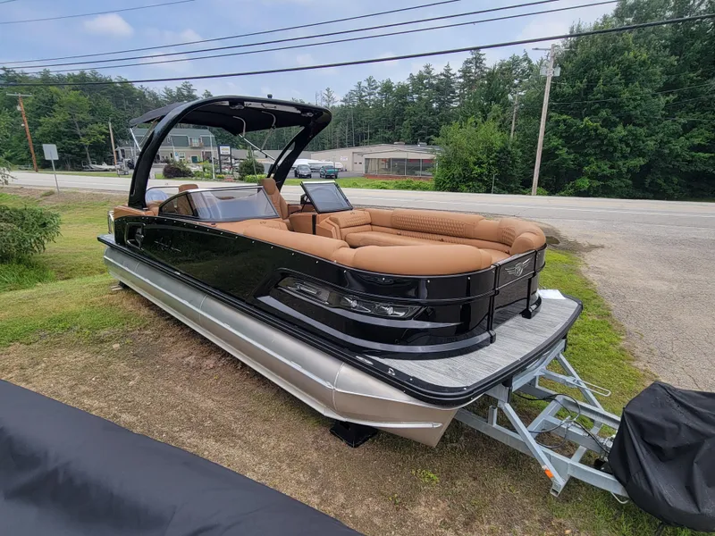 Slide: The Image of 2024 Avalon Excalibur WQL 27 Tri-Toon boat with luxurious seating on display. - 7