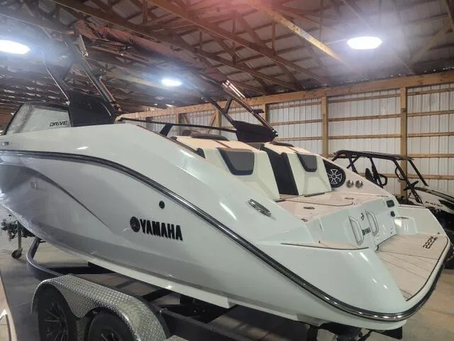 Slide: The Image of 2023 Yamaha Boats 222XD in a warehouse, showcasing sleek design and modern features. - 2
