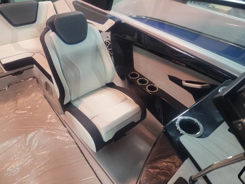 Slide: The Image of 2023 Yamaha Boats 222XD interior with modern seating and sleek dashboard design. - 5