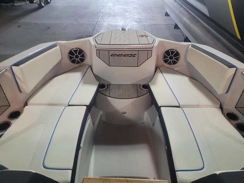 Slide: The Image of 2023 Yamaha Boats 222XD interior with spacious seating and modern design. - 7