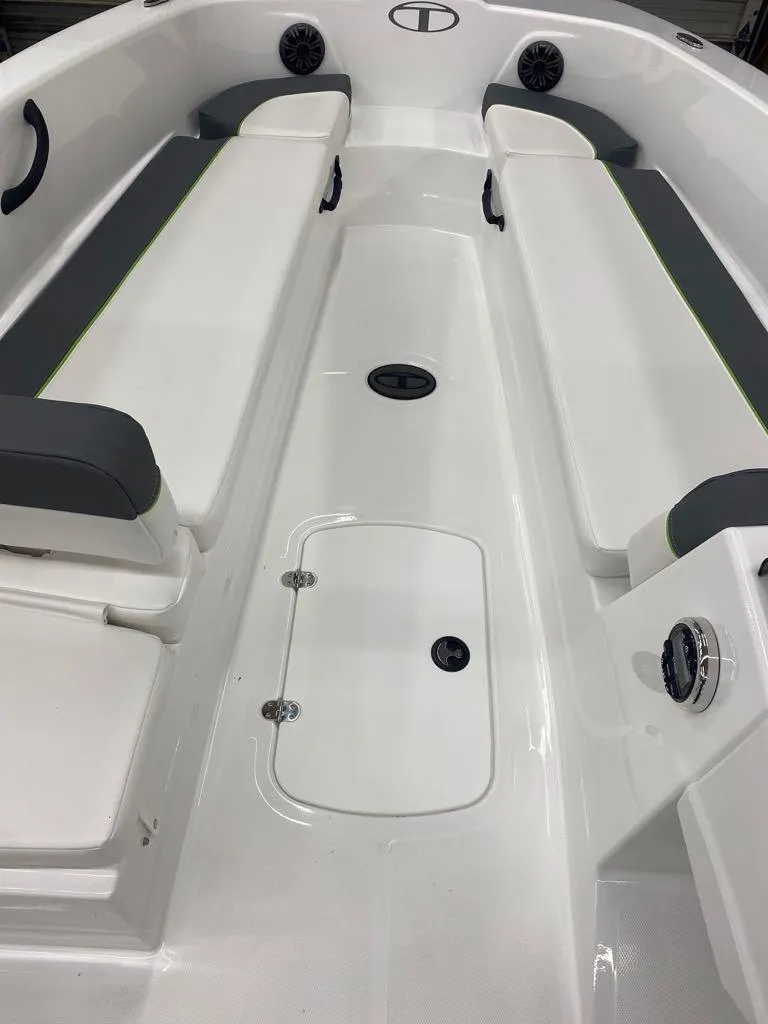 Slide: The Image of 2024 Tahoe T18 boat interior with white and gray seating. - 2