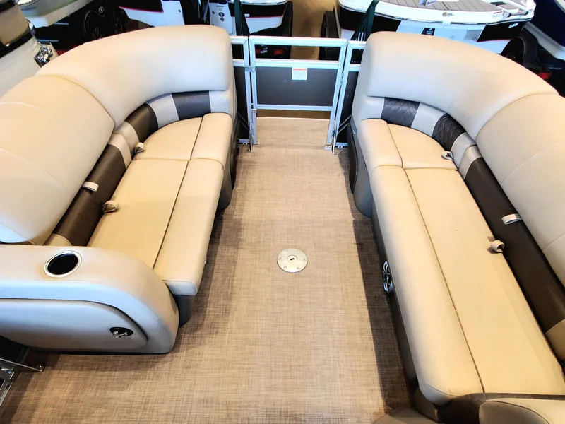 Slide: The Image of 2024 Sun Tracker SportFish 22 DLX pontoon boat on trailer. - 2