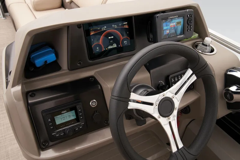 Slide: The Image of 2024 Sun Tracker SportFish 22 DLX dashboard with steering wheel and electronic displays. - 39