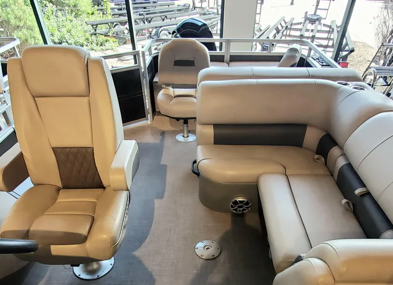 Slide: The Image of Interior of 2024 Sun Tracker SportFish 22 DLX pontoon boat with beige seating. - 4